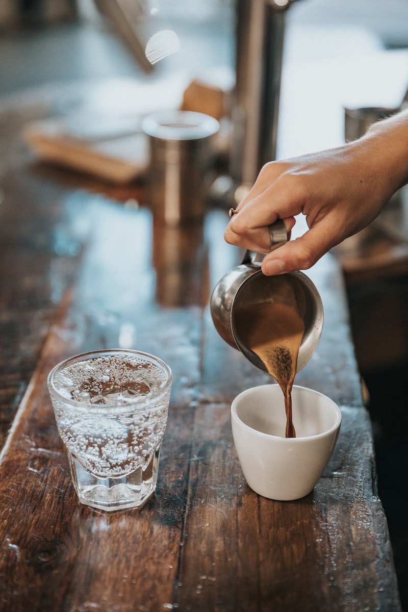 Barista pouring coffee